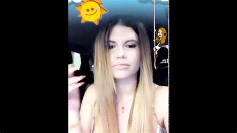 Chanel West Coast flashes her nipple in a car .